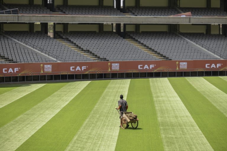 A groundkeeper puts the finishing touches to the pitch in Nairobi ahead of the African Nations Championship (SIMON MAINA)