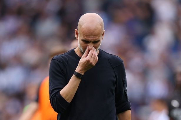 Pep Guardiola reacts following the team
